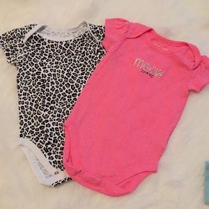 Two baby girl onesies.